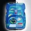 A split image showing a blue backpack with a green and yellow wave pattern. The left side is dark, and the right side is light. Náhled obrázku produktu