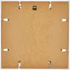 The back of a white picture frame with metal clips holding the backing in place. Produktbild-Vorschau