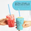Two hands holding colorful plastic cups filled with a slushy drink and a blue straw. Produktbild-Vorschau