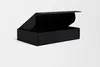 A black cardboard box with its lid open, shown on a white background. Podgląd zdjęcia produktu