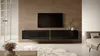 A modern living room with a wall-mounted TV stand and television. Voir les images du produit
