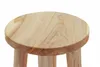 A close-up view of the top of a wooden stool. Produktbild-Vorschau