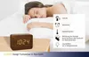 A woman sleeping in bed next to a wooden alarm clock. Anteprima dell’immagine prodotto