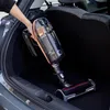 A person is holding a vacuum cleaner in the trunk of a car. Produktbild-Vorschau