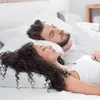 A couple sleeping in bed. Produktbild-Vorschau