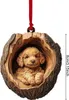 A wooden ornament of a puppy in a hollowed-out log, hanging by a red ribbon. Produktbild-Vorschau