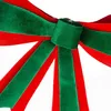 A close-up view of a red and green velvet bow, likely for Christmas decoration. Produktbild-Vorschau