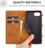A hand is holding a brown leather phone case open, revealing card slots and a black phone holder. Anteprima dell’immagine prodotto