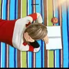 A person lying on a striped blanket with a notebook and an apple. Produktbild-Vorschau