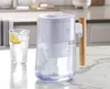 A water filter pitcher and a glass of water with lemon on a kitchen counter. Podgląd zdjęcia produktu