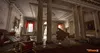 A grand, opulent room in disarray, with a grand piano overturned and debris scattered across the floor. The room features large columns, ornate paintings, and red velvet curtains. Produktbild-Vorschau