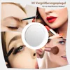 A collage of four close-up images showing different aspects of applying makeup, with a central circular mirror. Voir les images du produit