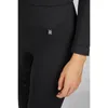 Close-up of a person wearing black riding leggings. Produktbild-Vorschau