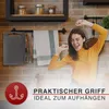 A woman is happily stretching in a kitchen setting, with kitchenware hanging on the wall. Anteprima dell’immagine prodotto
