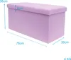 A purple storage ottoman with dimensions indicated by measurement lines and text. Náhled obrázku produktu