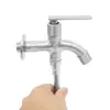 A hand holding a stainless steel faucet against a white background. Podgląd zdjęcia produktu