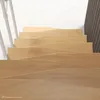 A view looking down a set of wooden stairs with a white railing on the left and a dark wooden wall on the right. Produktbild-Vorschau