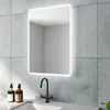 A bathroom mirror with integrated LED lighting is shown above a sink with a faucet and soap dispensers. Produktbild-Vorschau