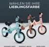 Three balance bikes in different colors are displayed against a gradient background, with text above them. Produktbild-Vorschau