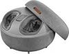 A close-up, slightly angled view of a gray fabric foot massager with its lid open. Voir les images du produit