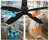 A split image showing a black ceiling fan in two different room settings, illustrating airflow direction with arrows. Podgląd zdjęcia produktu