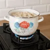 A pot of dumplings is being boiled on a gas stove. Produktbild-Vorschau