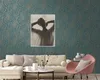 A living room scene with a sofa, chair, and coffee table, featuring wallpaper. Náhľad obrázku produktu