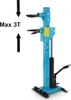 A blue hydraulic spring compressor with black accents, set against a white background. Arrows and text indicating maximum load are visible on the left. Produktbild-Vorschau