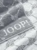 A close-up view of a folded gray towel with a white pattern and the brand name "JOOP!" embossed on it. Podgląd zdjęcia produktu
