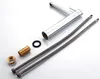 A faucet and its installation components are laid out on a white and gray background. Podgląd zdjęcia produktu