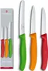Three Victorinox Swiss Classic knives with colored handles (red, orange, green) are displayed. A box showing the knives is on the left. Produktbild-Vorschau