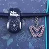 Close-up of a backpack closure and a butterfly charm. Anteprima dell’immagine prodotto
