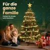 A family and a cat are gathered around a decorated Christmas tree with presents underneath. Produktbild-Vorschau