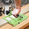A person is using a chainsaw attachment to cut a wooden plank. Náhled obrázku produktu