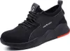 A black safety shoe with red accents on a white background. Produktbild-Vorschau