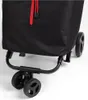 A close-up view of the bottom part of a black shopping trolley with red drawstrings. Podgląd zdjęcia produktu