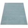 A plain, light turquoise rug is shown from a diagonal, slightly elevated perspective against a white background. Anteprima dell’immagine prodotto