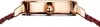 Close-up side view of a watch case with a rose gold finish and a red braided strap. Produktbild-Vorschau