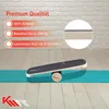 A balance board is shown on a yoga mat in front of a brick wall. Produktbild-Vorschau