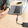 A person is using a laptop connected to an external hard drive via a USB-C adapter. Náhľad obrázku produktu