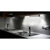 A kitchen counter with a sink, faucet, stovetop, and an under-cabinet LED light. Produktbild-Vorschau