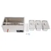 A stainless steel chafing dish warmer with three food pans and lids, along with some small accessories, laid out on a white background. Náhled obrázku produktu