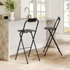 Two folding bar stools are placed at a kitchen island with a marble countertop and a gold faucet. Produktbild-Vorschau