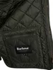 Close-up of the interior lining of a green jacket, showing a pocket with a brand label. Produktbild-Vorschau