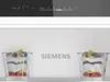 Inside of a refrigerator with two glasses of dessert and the Siemens logo on the back wall. Produktbild-Vorschau