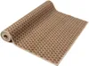 A rolled-up rug with a geometric pattern on a white background. Podgląd zdjęcia produktu