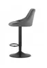 A gray velvet bar stool with a black base and footrest, shown from the side against a white background. Produktbild-Vorschau