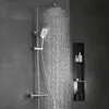 A modern bathroom shower system with water flowing from the overhead shower head and hand shower. Anteprima dell’immagine prodotto