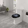 A modern bathroom with a toilet featuring a decorative seat, a vanity with a sink, and a window with curtains. Produktbild-Vorschau