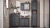 A bathroom scene with dark gray furniture, including a sink, cabinets, and a tall storage unit. Náhľad obrázku produktu